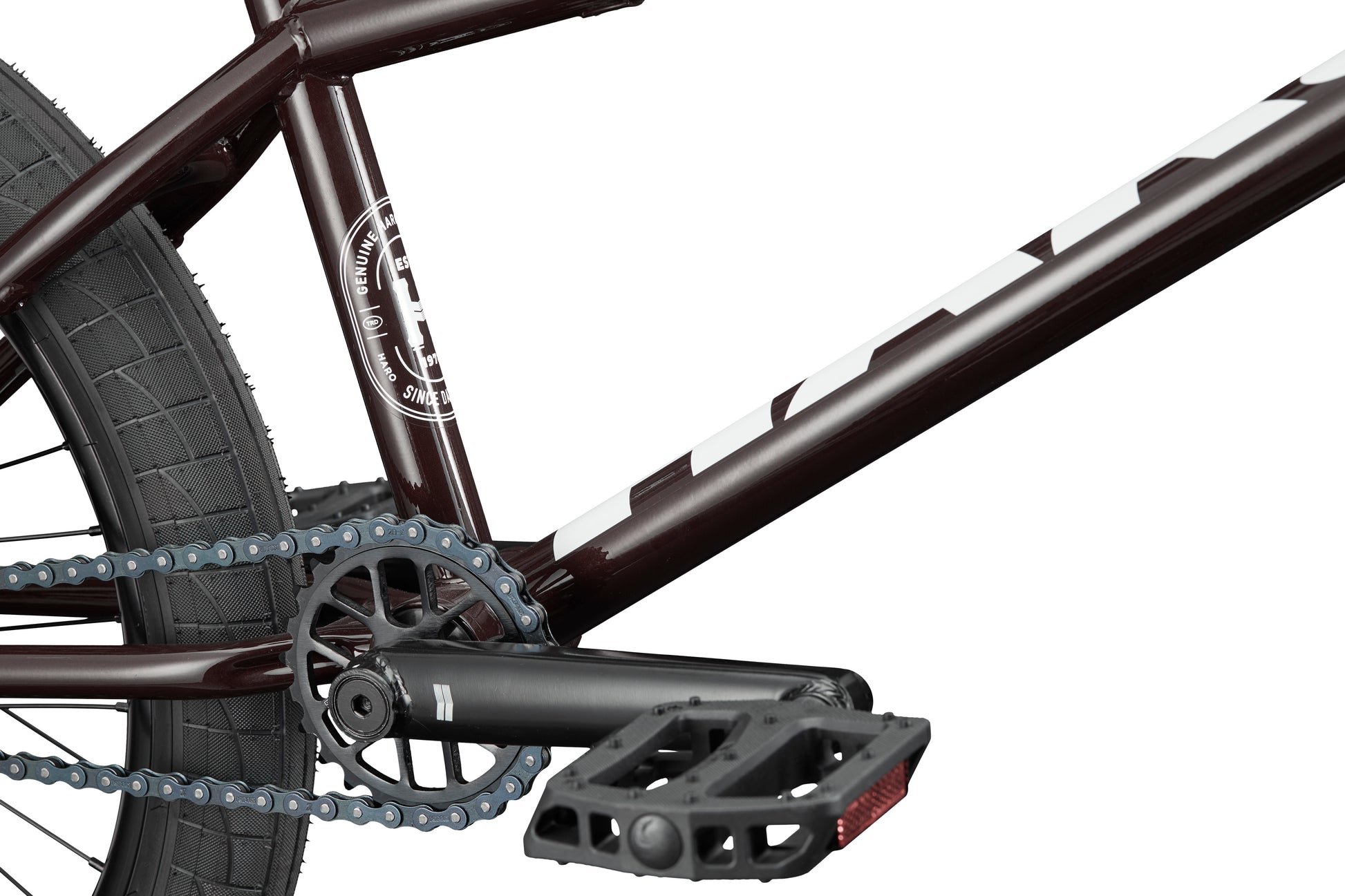 Close-up of the Clairemont BMX bike’s pedal, chain, crankset, frame, and rear tire.