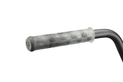 Close-up of Dana's black handlebar with a geometric-textured gray grip, designed for pro-level performance.