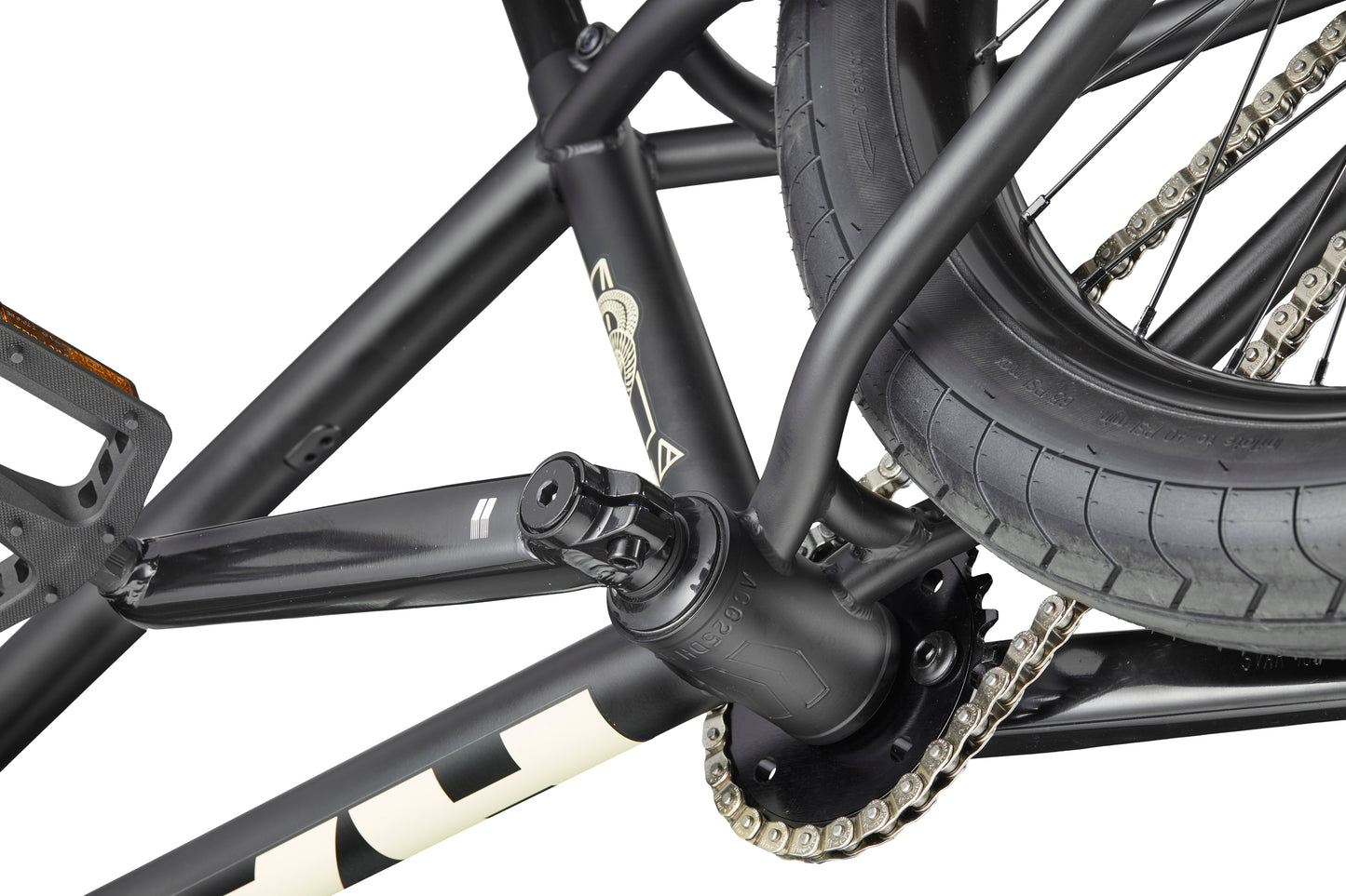 Close-up of Dana's black crankset, rear wheel, and chain, designed for pro-level street performance on a white background.