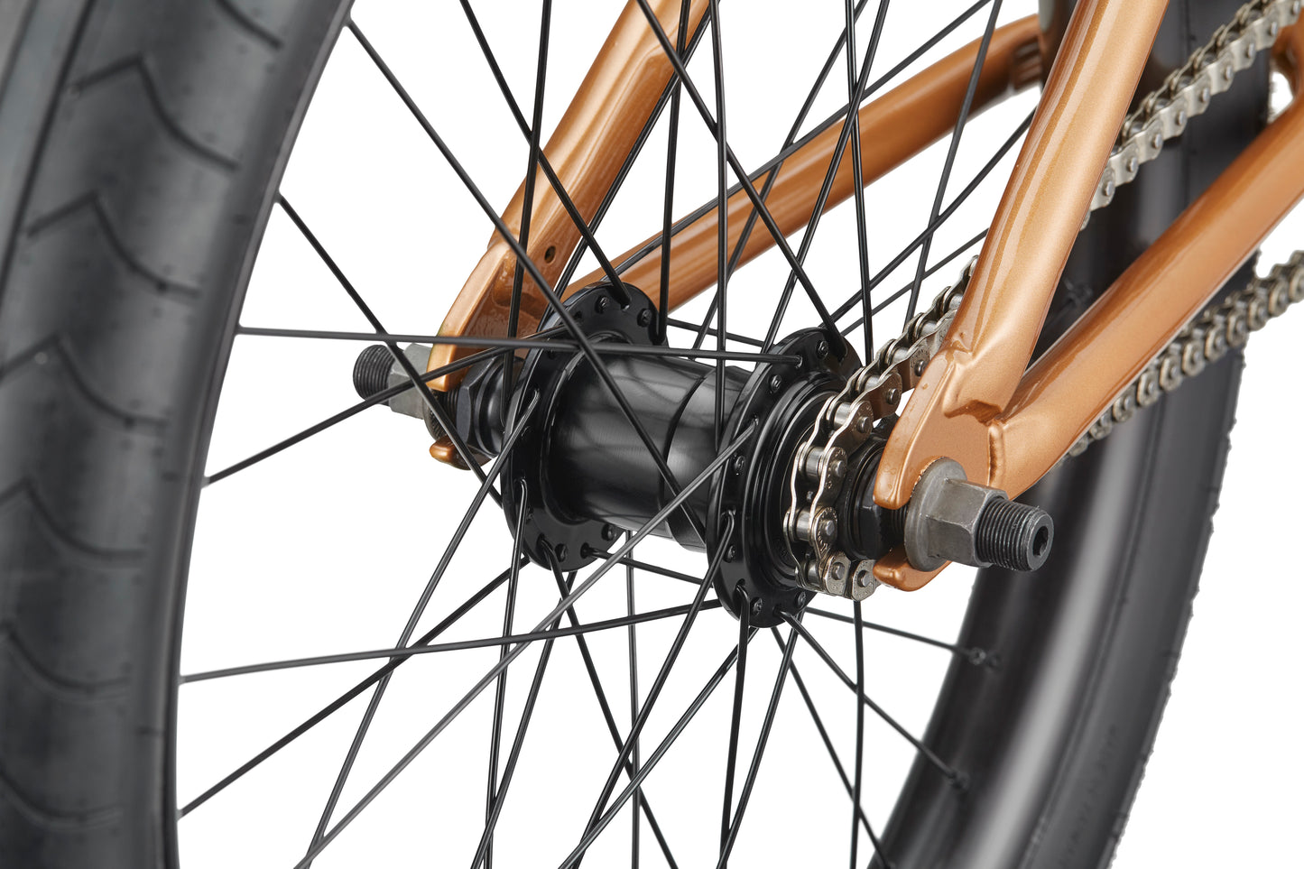 Close-up of Dana's rear wheel hub, spokes, chain, and tire, featuring a metallic bronze frame for pro-level street performance.