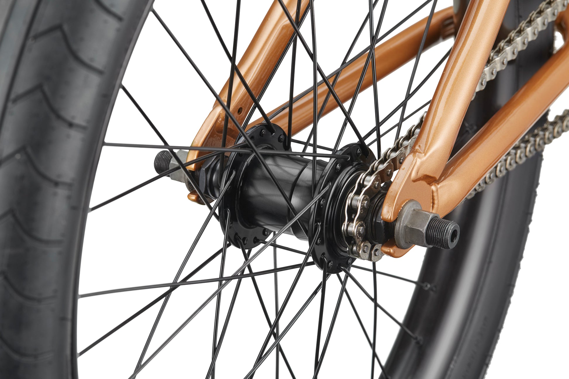 Close-up of Dana's rear wheel hub, spokes, chain, and tire, featuring a metallic bronze frame for pro-level street performance.