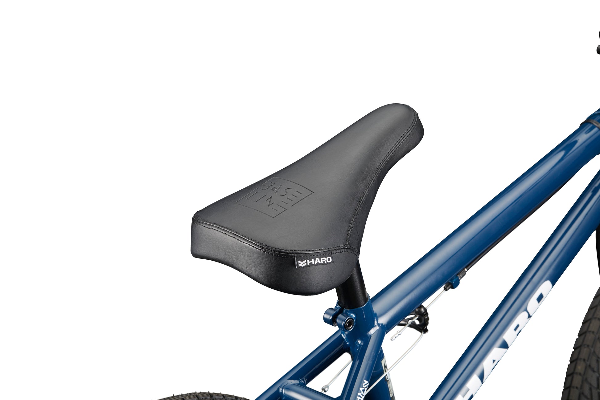 Close-up of a black BMX seat on the Downtown 16 bike with a blue frame, shown against a white background.