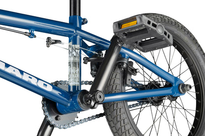 Close-up of the Downtown 16’s blue frame, crank, pedal, and rear wheel showing detailed tire tread and chain.