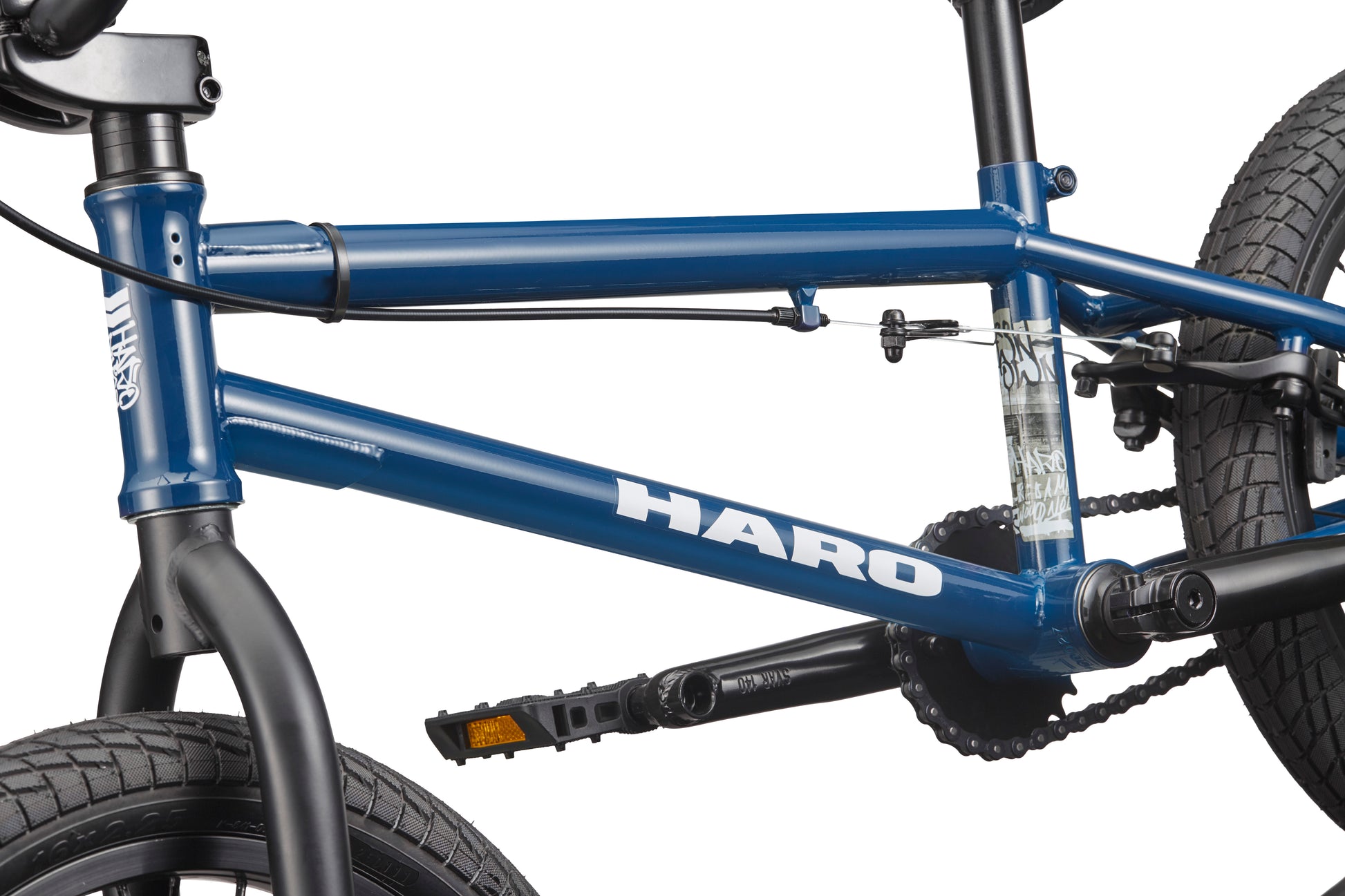 Close-up of the Downtown 16 BMX bike frame in blue, showing handlebars, pedals, chain, and black tires.