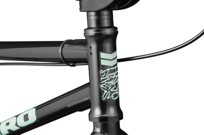 Close-up of the black Downtown 18 BMX frame with a white logo, ideal for small riders, showing handlebars and cables.