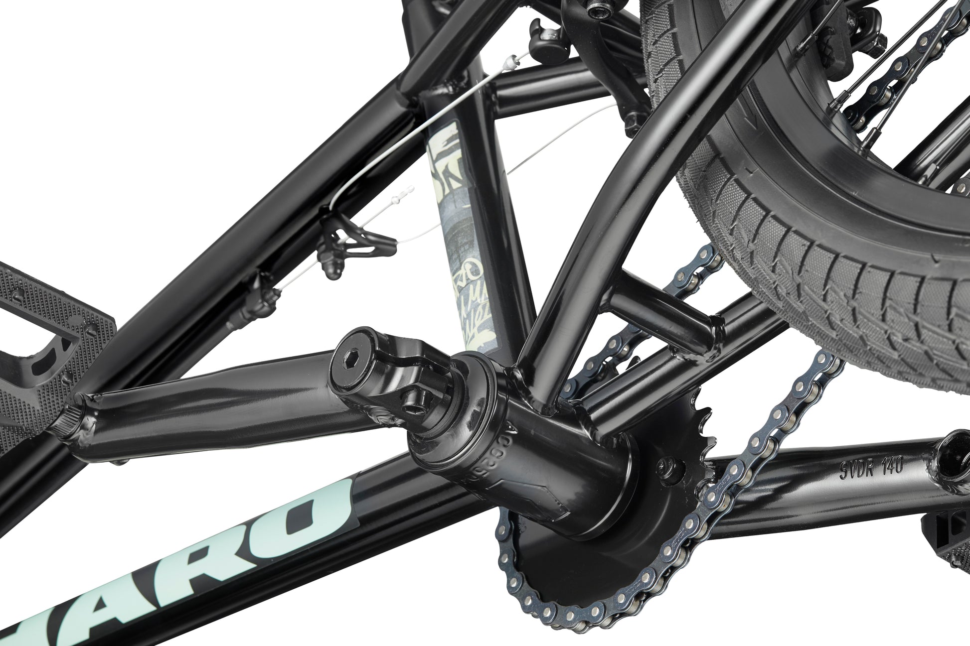 Close-up of the Downtown 18 BMX crank, chain, rear tire, and frame, highlighting the bike's gear mechanism on a white background.