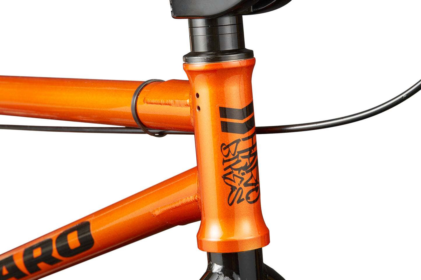 Close-up of the Downtown 18 BMX frame in orange with black branding and visible cable, ideal for small riders.