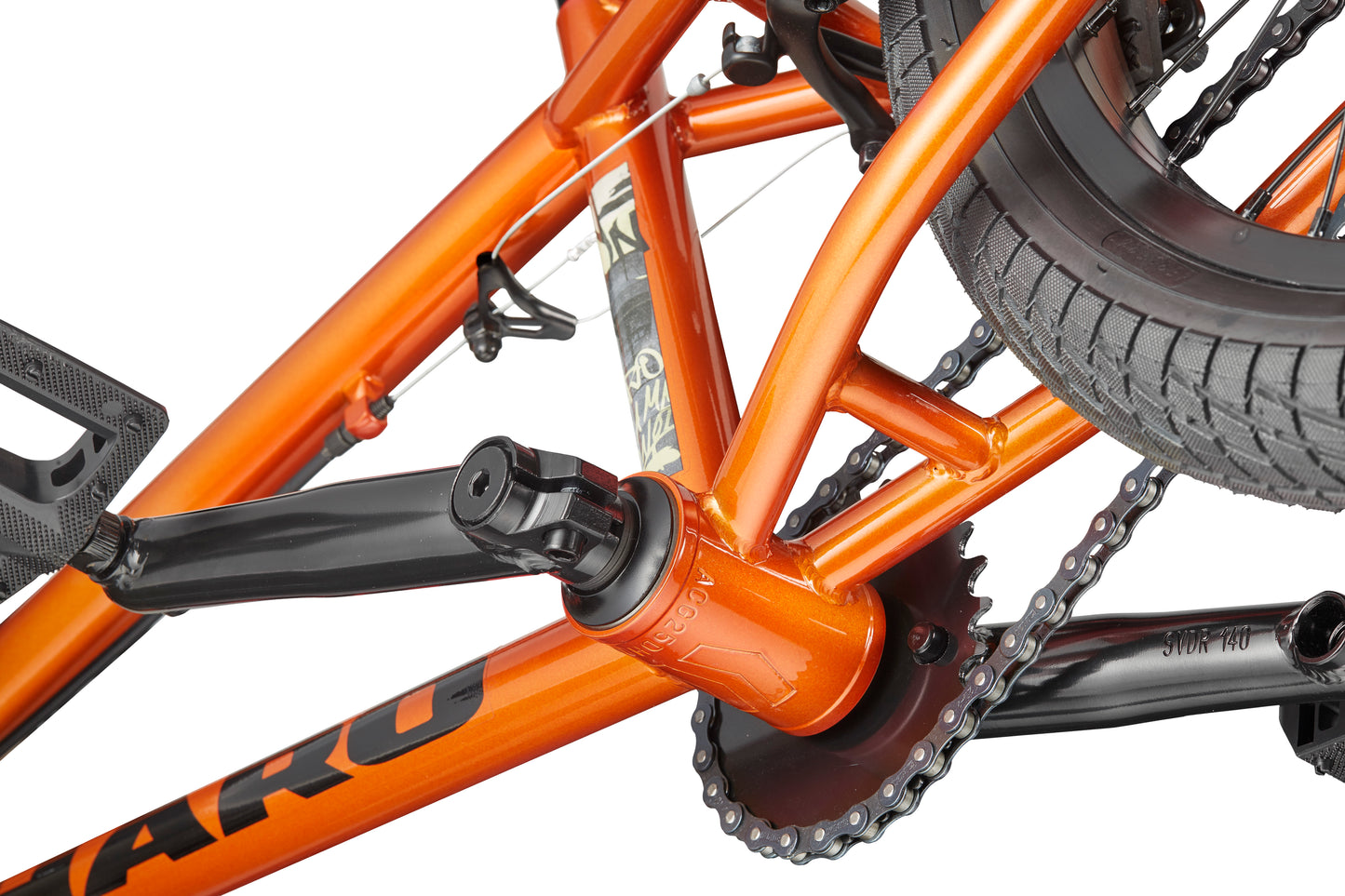 Close-up of a Downtown 18 BMX frame in orange, highlighting crank, chainring, and rear wheel—ideal for young riders.