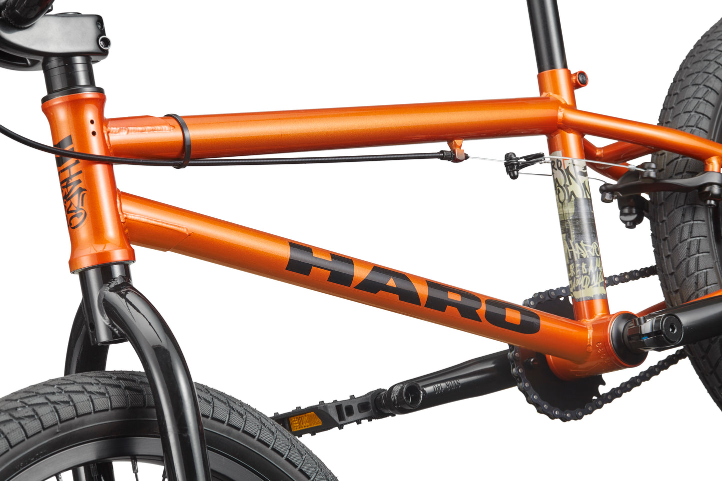 Close-up of a Haro Downtown 18 BMX frame, ideal for small riders, showing the front tire, pedals, and rear tire.