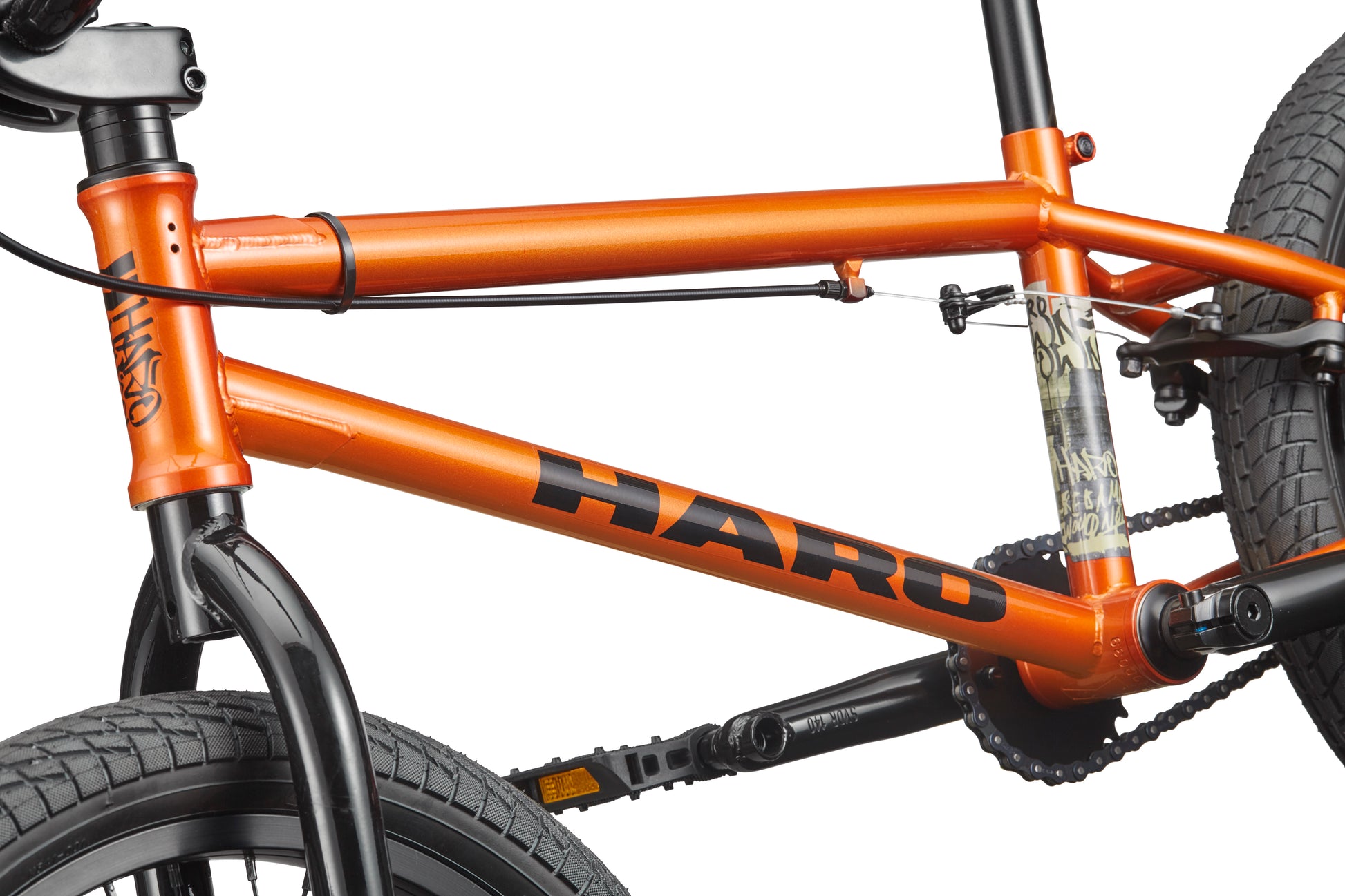 Close-up of a Haro Downtown 18 BMX frame, ideal for small riders, showing the front tire, pedals, and rear tire.