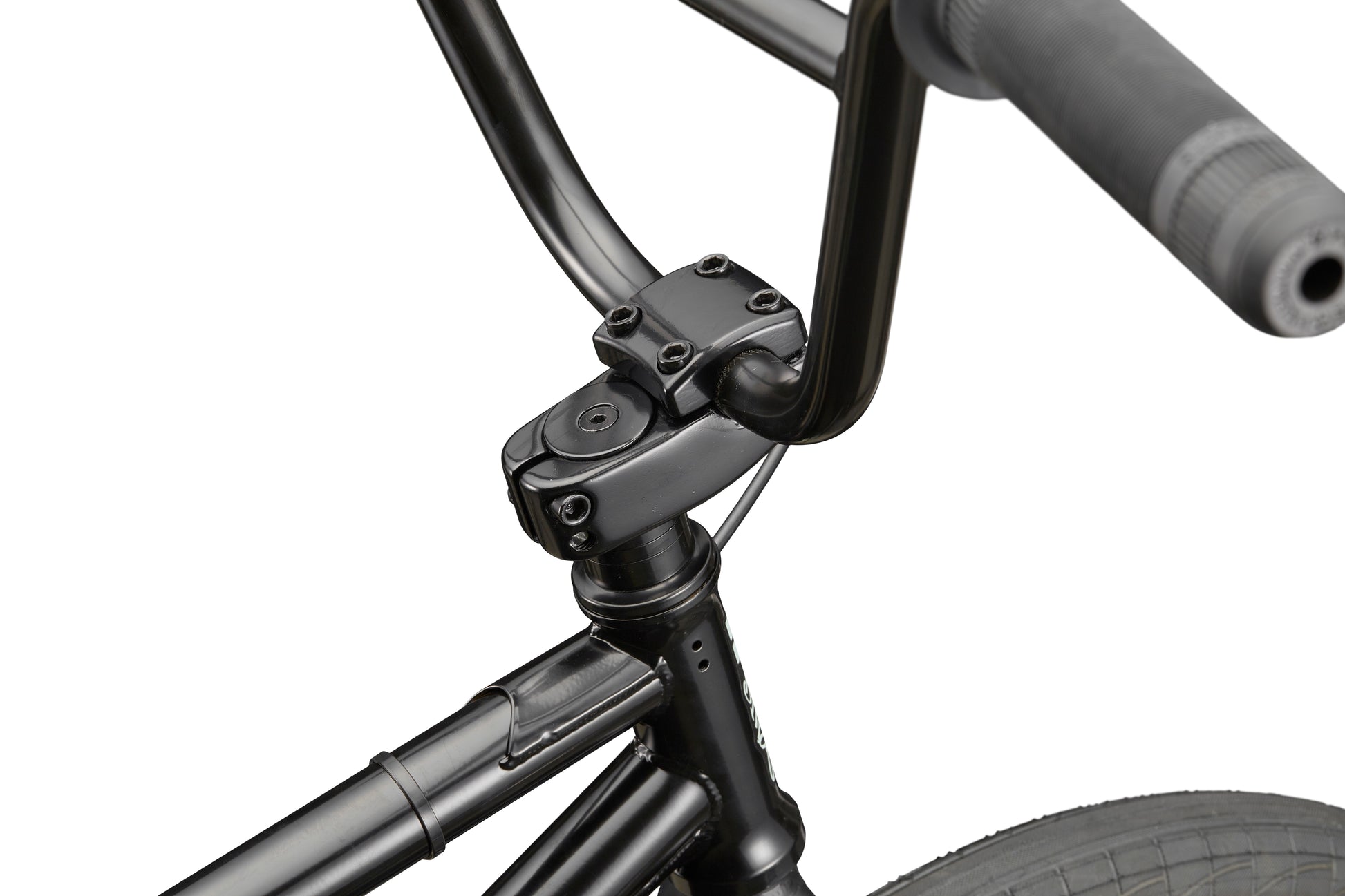 Close-up of Downtown 20 black BMX handlebars, stem, and front tire—ideal for entry-level riders against a white background.