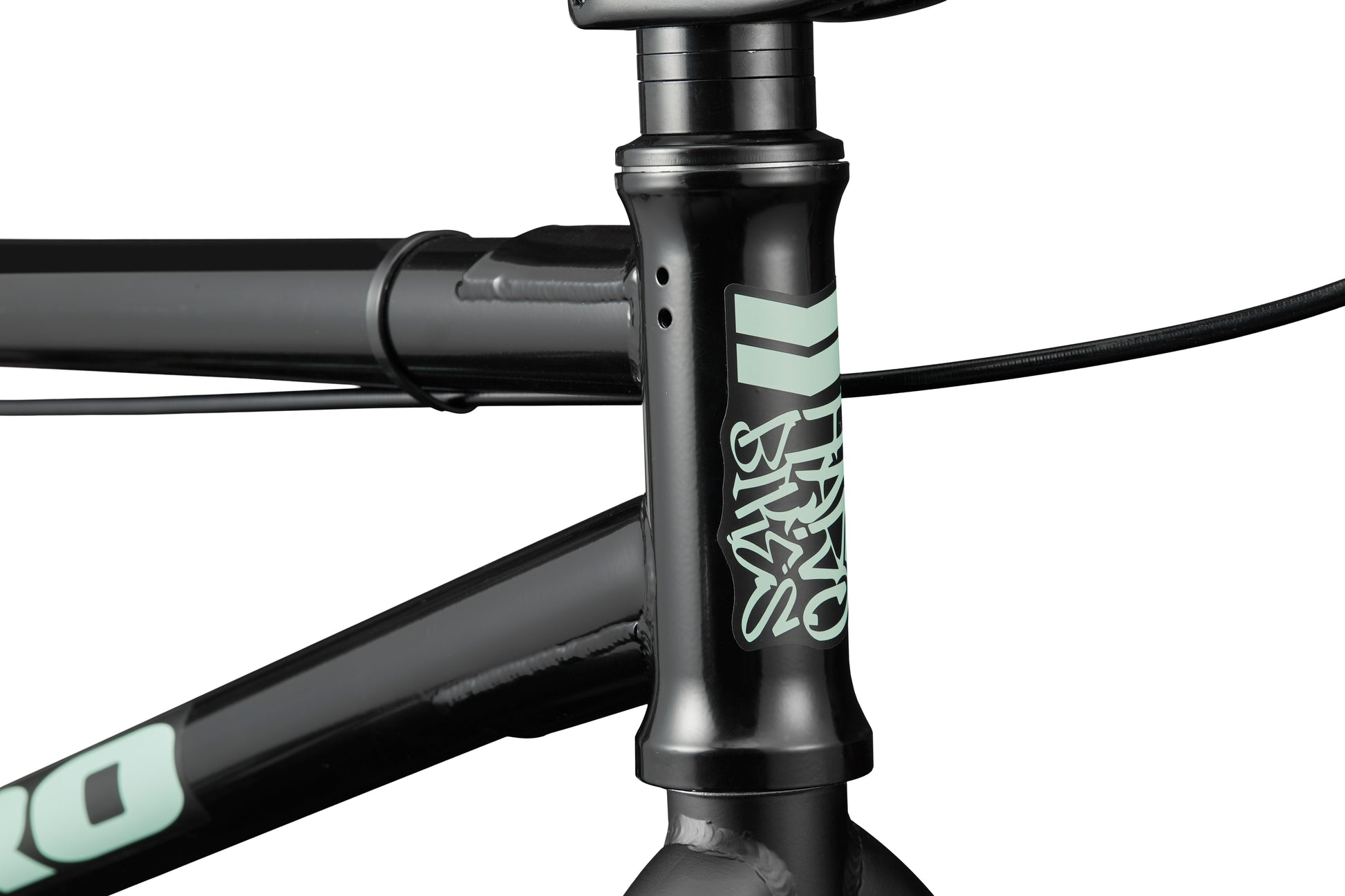 Close-up of the Downtown 20 BMX bike’s head tube showcasing the white Haro logo and front brake cable.