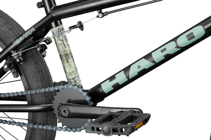 Close-up of a Downtown 20 BMX bike, showing the pedal, chain, rear wheel, and logo—perfect for entry-level riders.