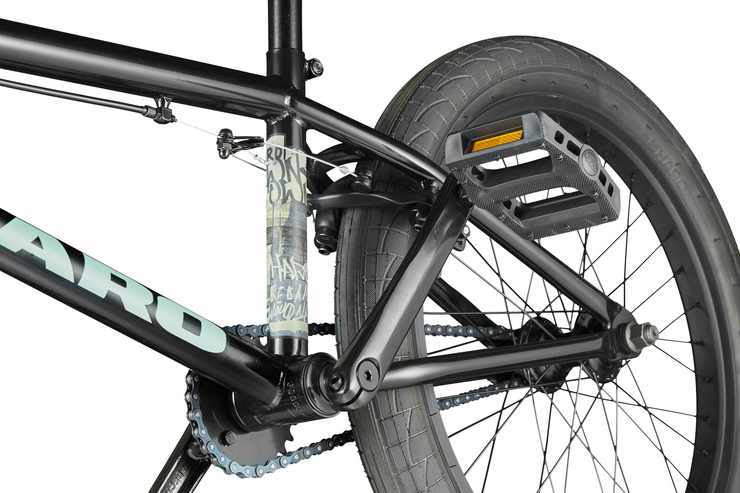 Close-up of the Downtown 20 BMX bike's rear wheel, pedal, chain, and frame—ideal for entry-level riders.