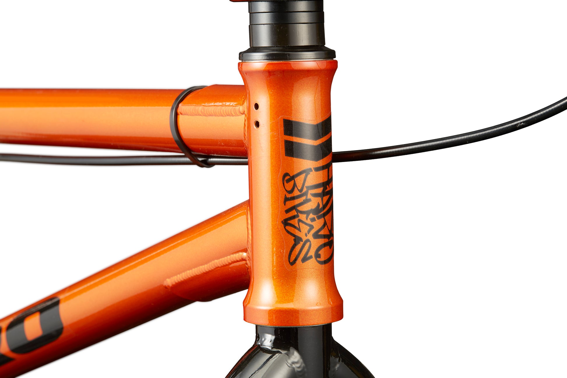 Close-up of the orange Downtown 20 BMX frame with visible cables, ideal for entry-level riders.