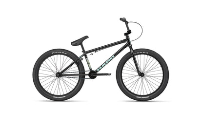 The Downtown 24 is a black BMX bike with thick 24” wheels, a straight handlebar, and SE BIKES branding on the frame.
