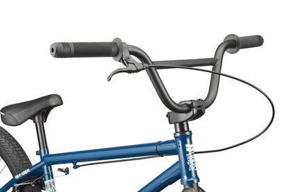 Close-up of the Downtown 24's handlebars, brake lever, and blue frame with 24” wheels, highlighting its modern versatility.