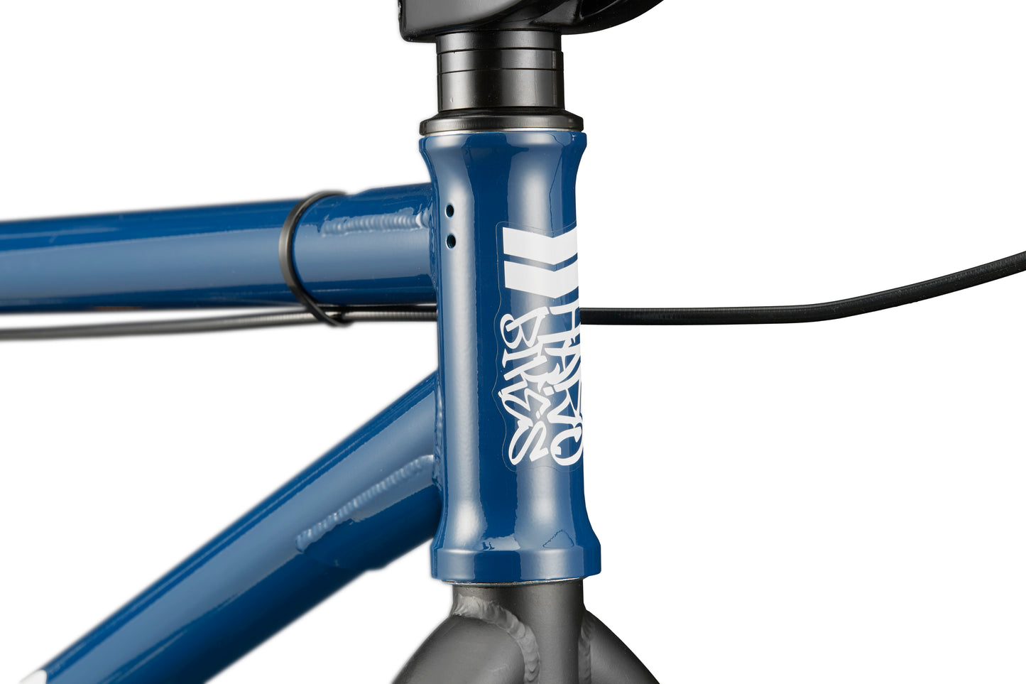 Close-up of the Downtown 24 BMX’s head tube with white graphics, black cables, and modern versatility for 24" wheels.