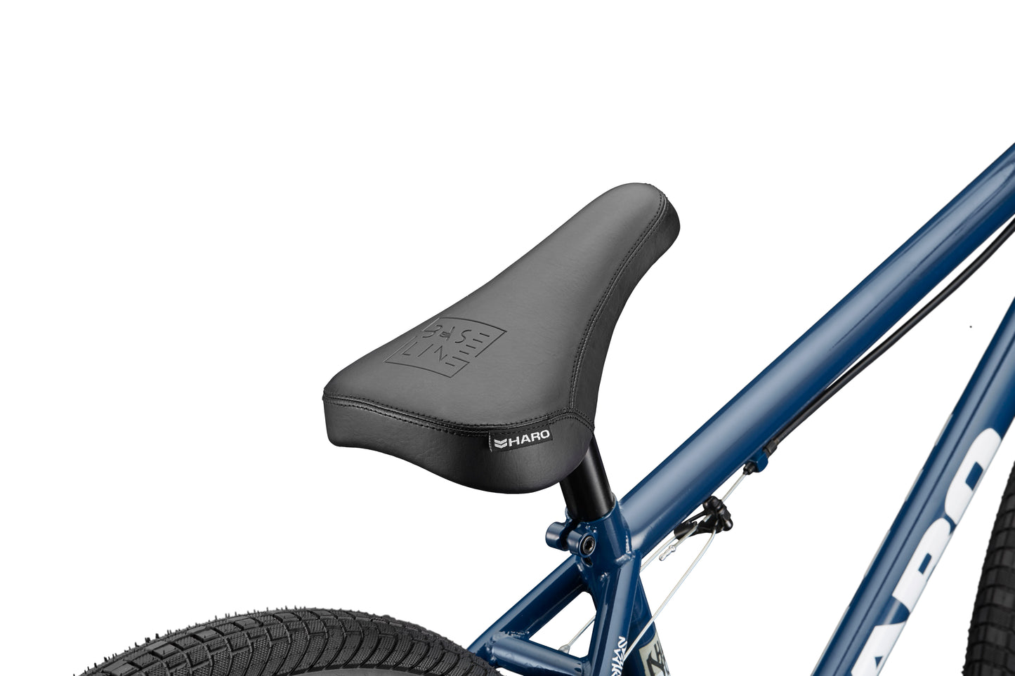 Close-up of a black seat on a blue Downtown 24 BMX bike with 24” wheels, visible tire, and partial HARO logo.