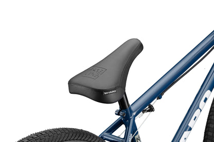 Close-up of a black seat on a blue Downtown 24 BMX bike with 24” wheels, visible tire, and partial HARO logo.
