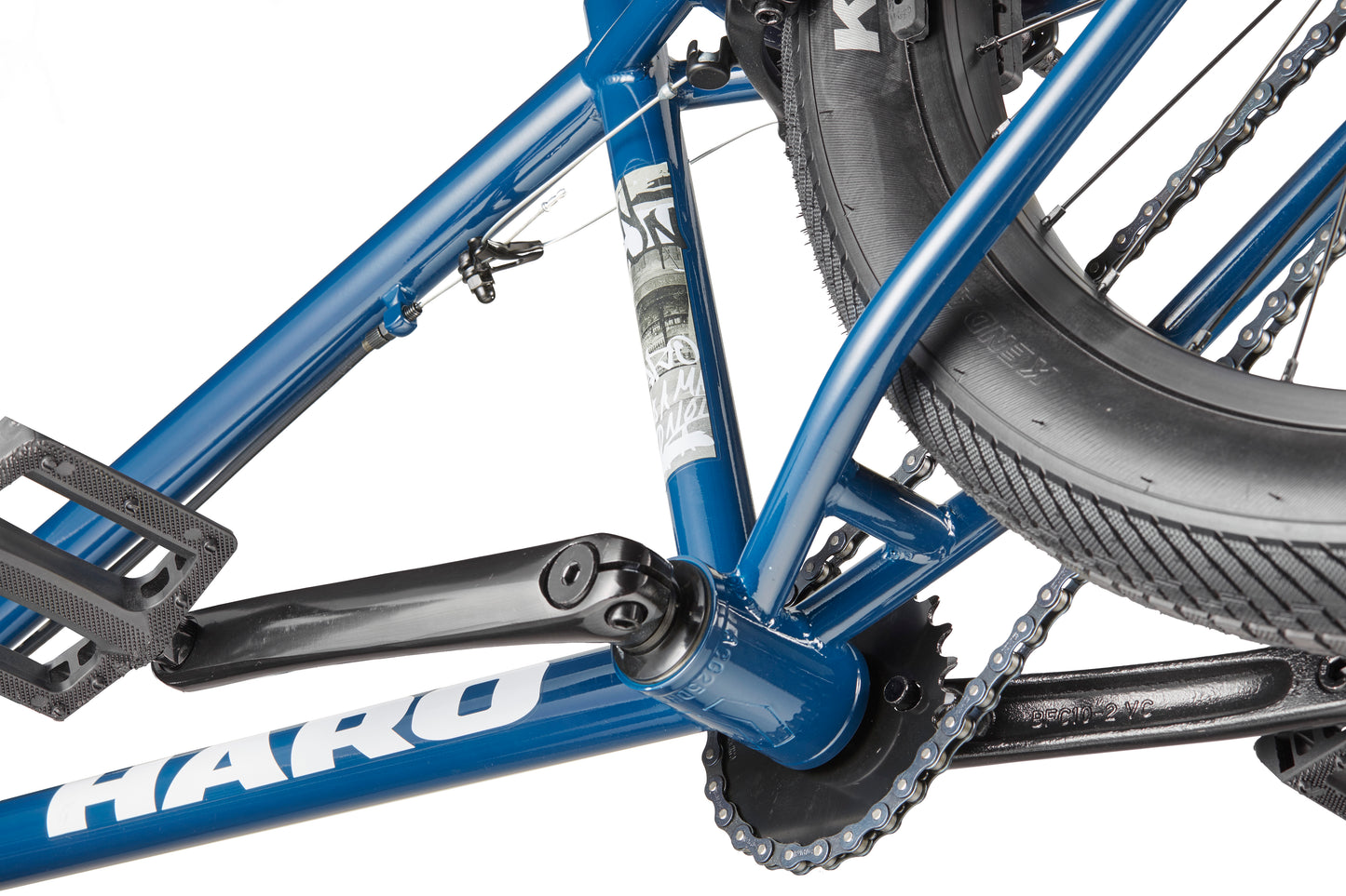 Close-up of a blue Downtown 24 BMX frame with 24” wheels, crank, pedal, chain, rear wheel, and part of the branding visible.