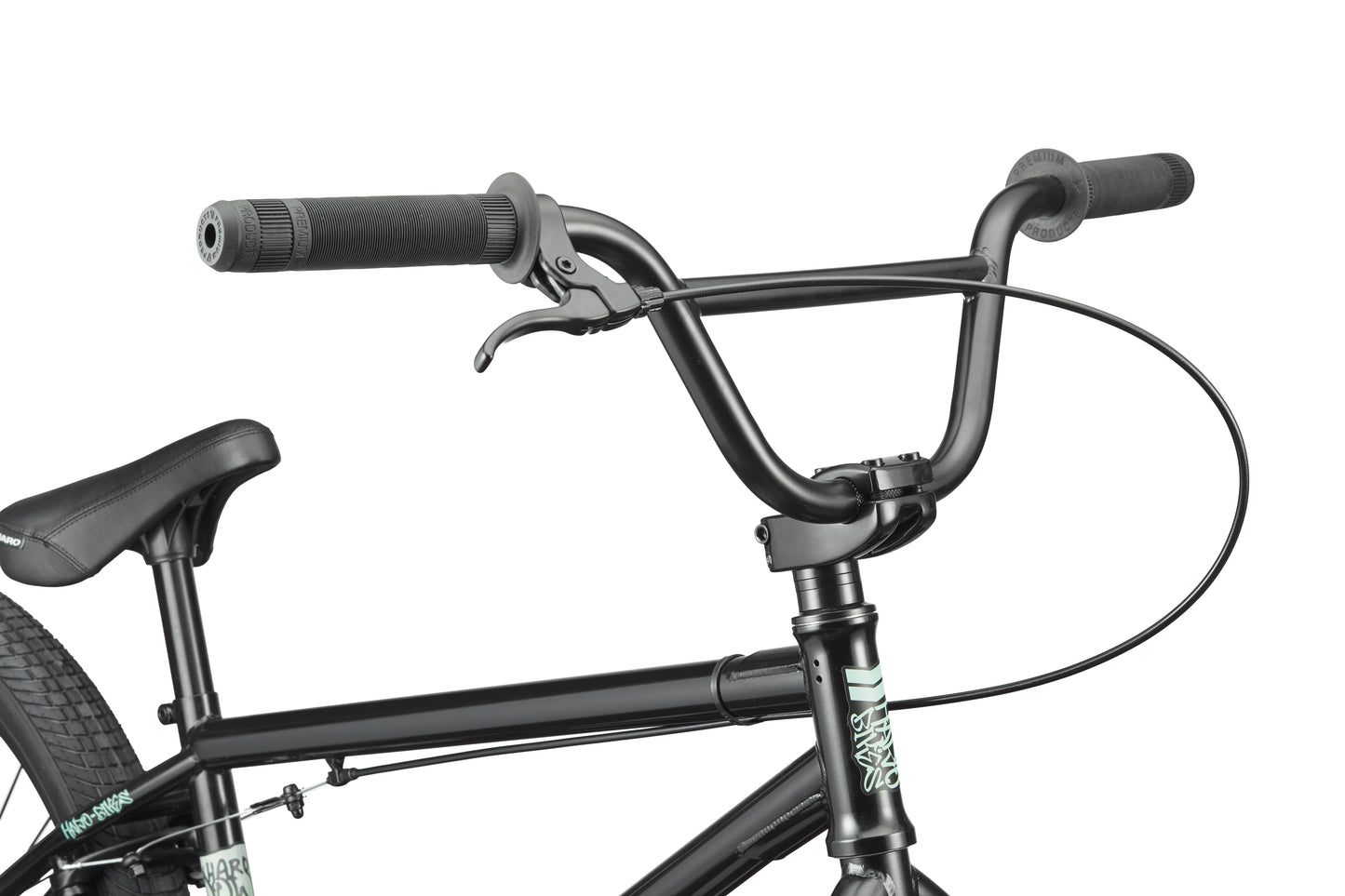 Close-up of Downtown 24 BMX bike’s handlebars, brake lever, and seat against a white background, highlighting modern versatility.