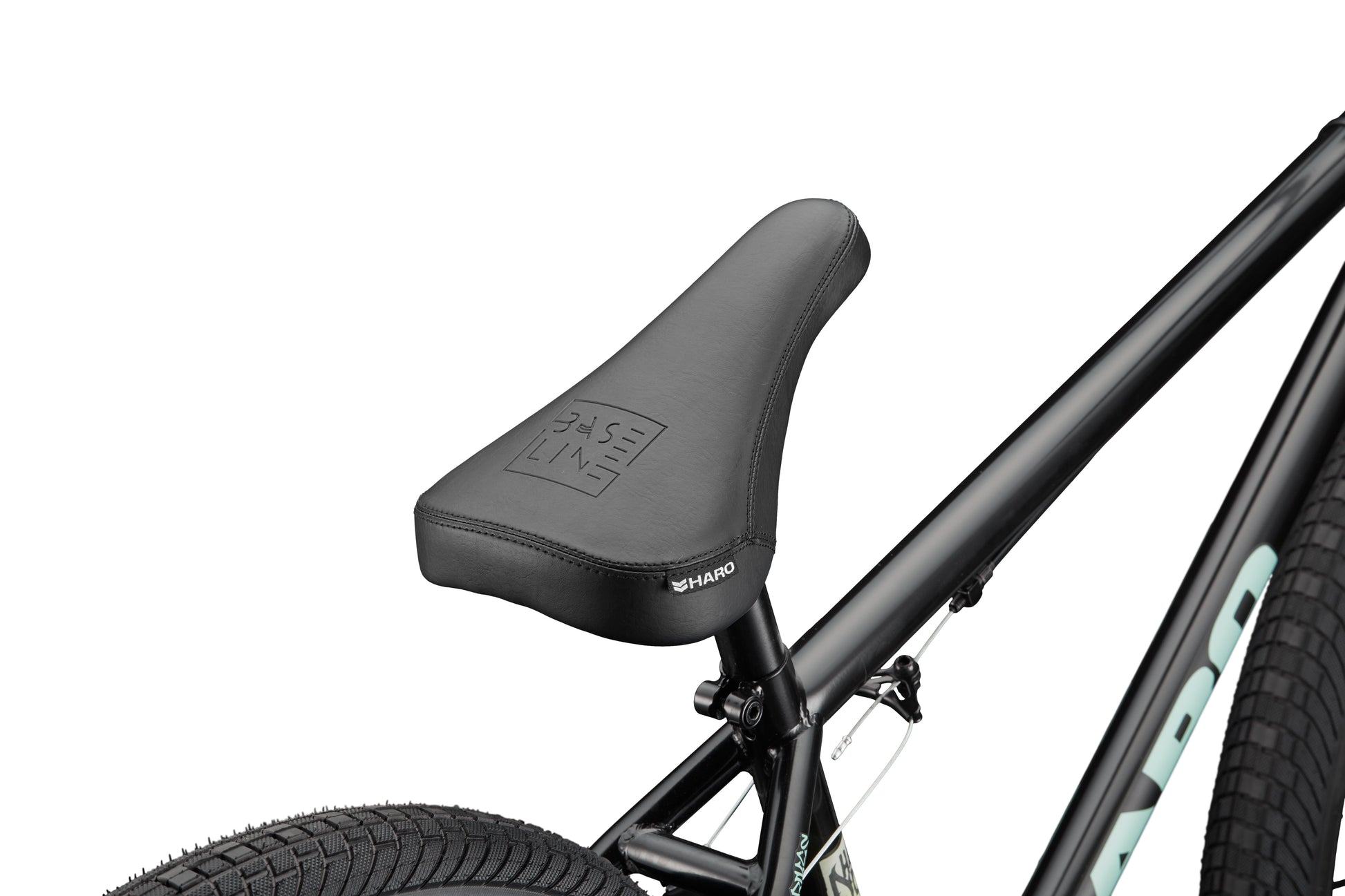 Close-up of a black bike seat on a Downtown 24 BMX frame with 24” wheels, showing modern versatility.
