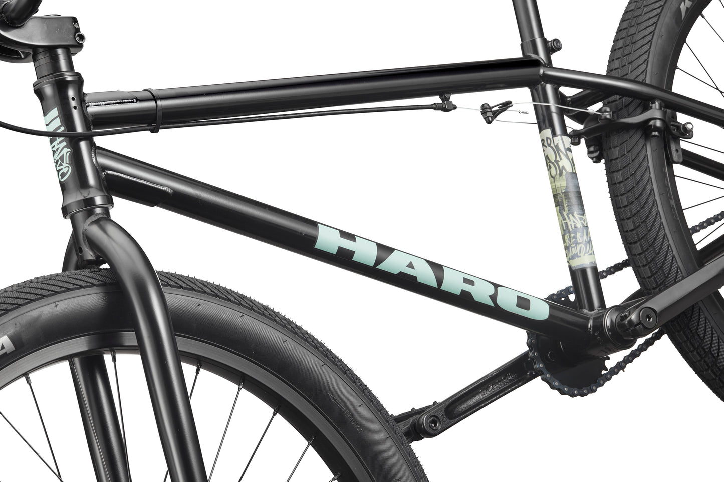 Close-up of a black Downtown 24 BMX bike with 24” wheels, featuring the HARO logo on the frame against a white background.