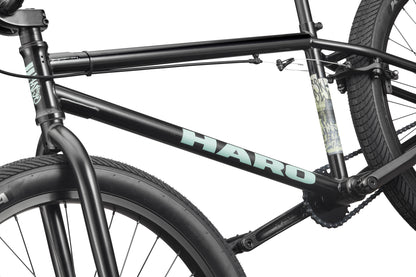 Close-up of a black Downtown 24 BMX bike with 24” wheels, featuring the HARO logo on the frame against a white background.