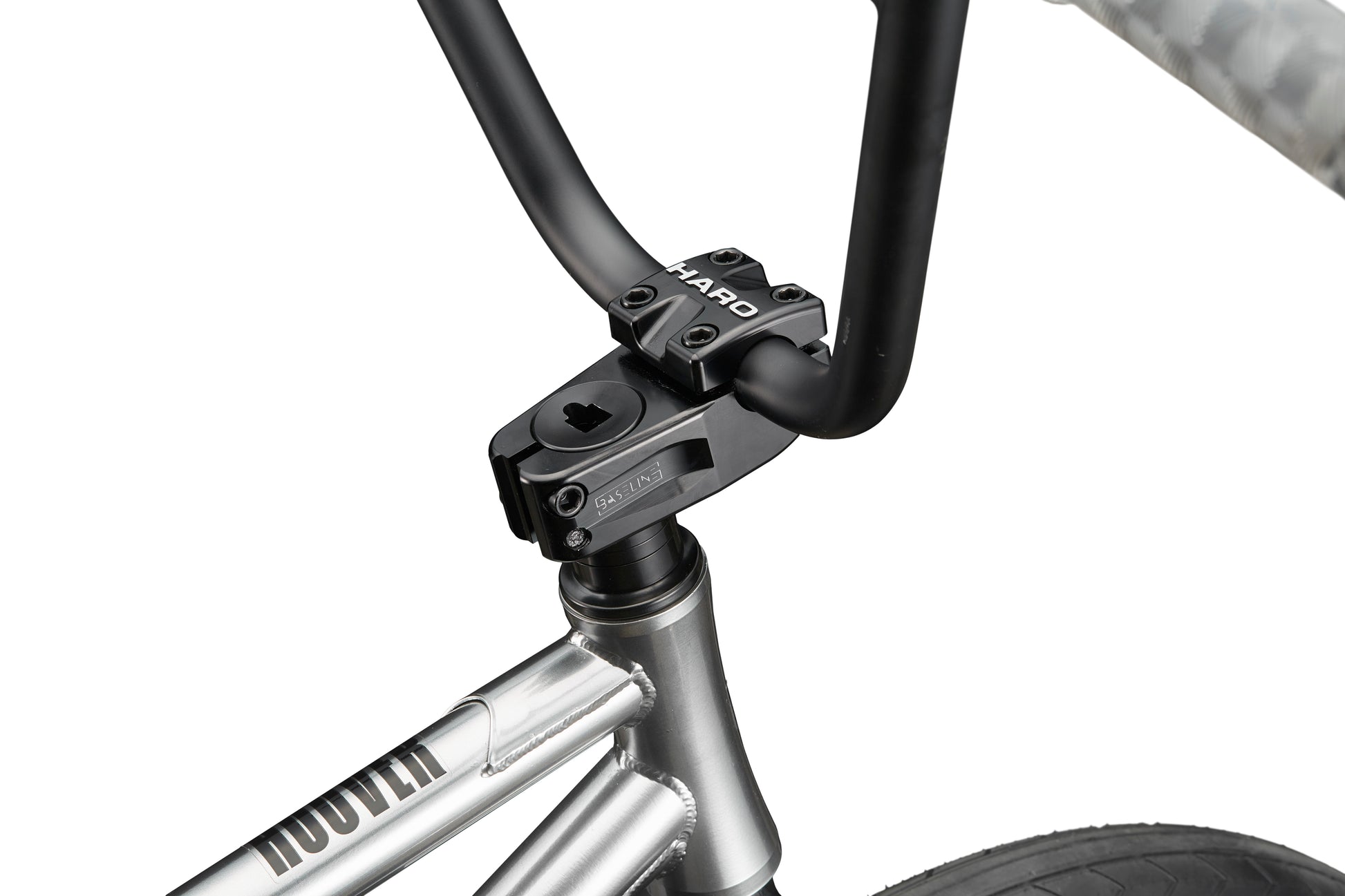 Close-up of a silver Hoover street BMX bike handlebar and stem, featuring Hoover branding with part of the front wheel and frame visible.