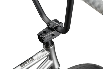 Close-up of a silver Hoover street BMX bike handlebar and stem, featuring Hoover branding with part of the front wheel and frame visible.