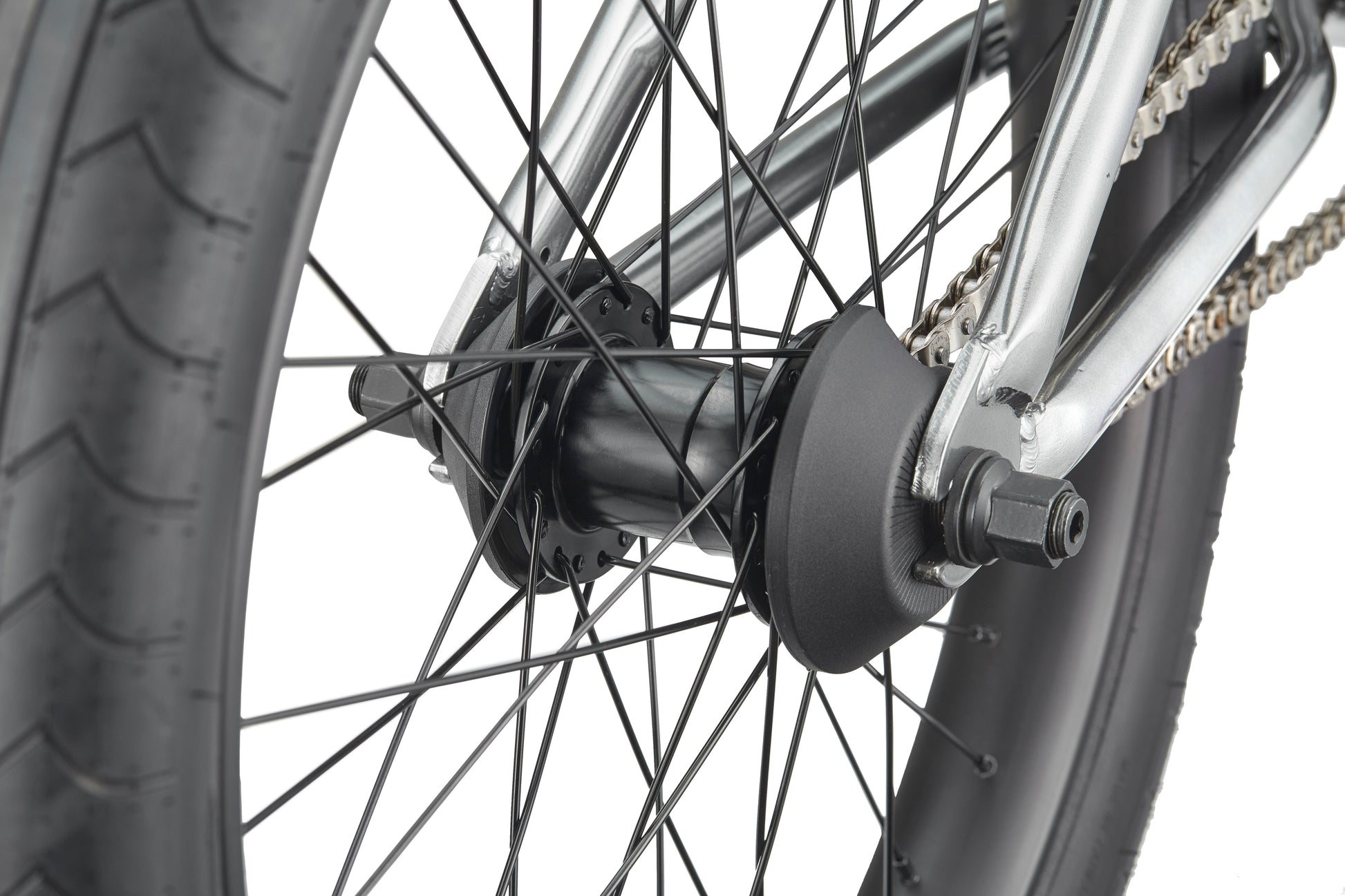 Close-up of a Hoover BMX bike rear wheel, highlighting the tire, spokes, axle, chain, and frame.