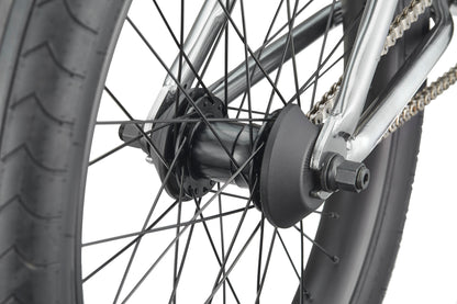 Close-up of a Hoover BMX bike rear wheel, highlighting the tire, spokes, axle, chain, and frame.