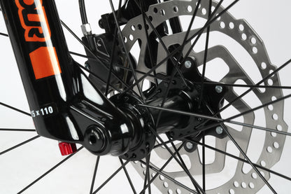 Close-up of a Double Peak 2s aluminum frame and front wheel hub, highlighting mechanical details and the SR Suntour fork.