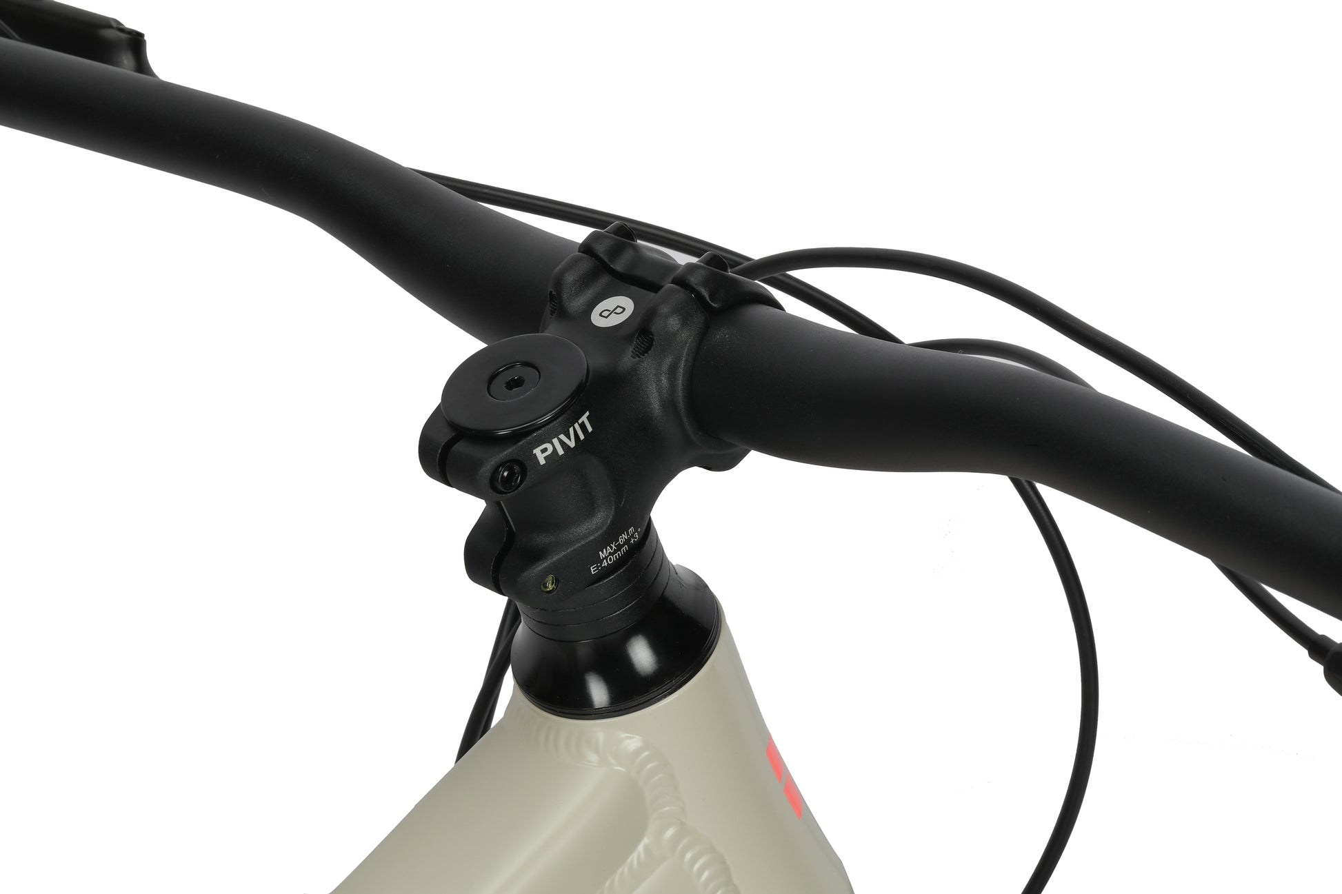 Close-up of black handlebars and stem with cables on a beige aluminum frame, showing details of the Double Peak 2 bike.