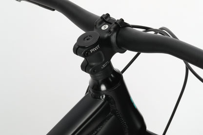 Close-up of bicycles black handlebars, perfect for your next Double Peak 3 MTB adventure.