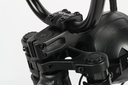 Close-up of Skwad 1s black handlebar with HARD logo, throttle controls, and a powerful 750W motor.