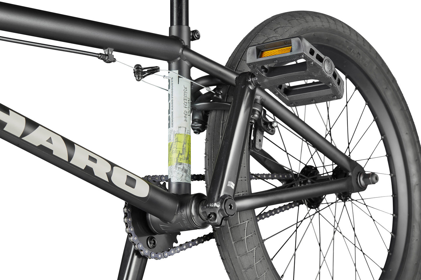 Close-up of the BLVD bike’s rear wheel, pedal, and frame, highlighting the chain and tire tread for all-around performance.