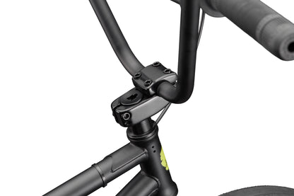 Close-up of BLVD bike's black handlebars, stem, and front frame with balanced geometry against a white background.