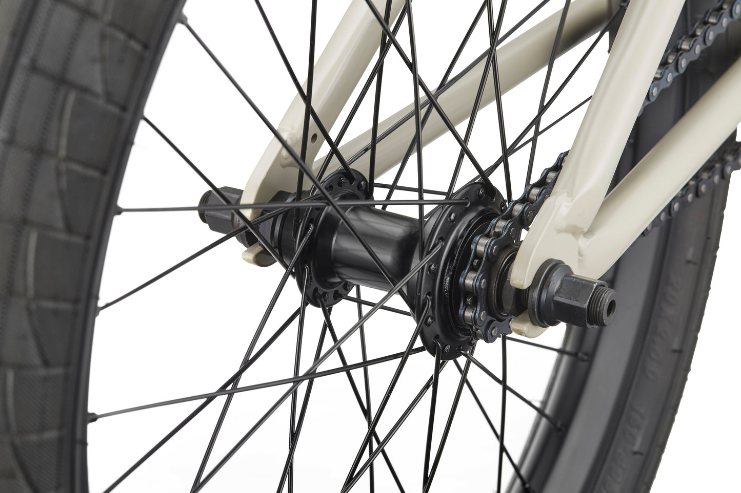 Close-up of the BLVD bike’s rear wheel, showcasing spokes, hub, axle, and frame for all-around performance.