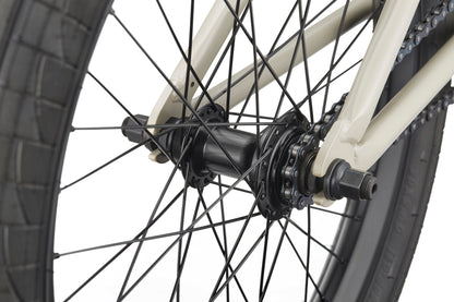 Close-up of the BLVD bike’s rear wheel, showcasing spokes, hub, axle, and frame for all-around performance.