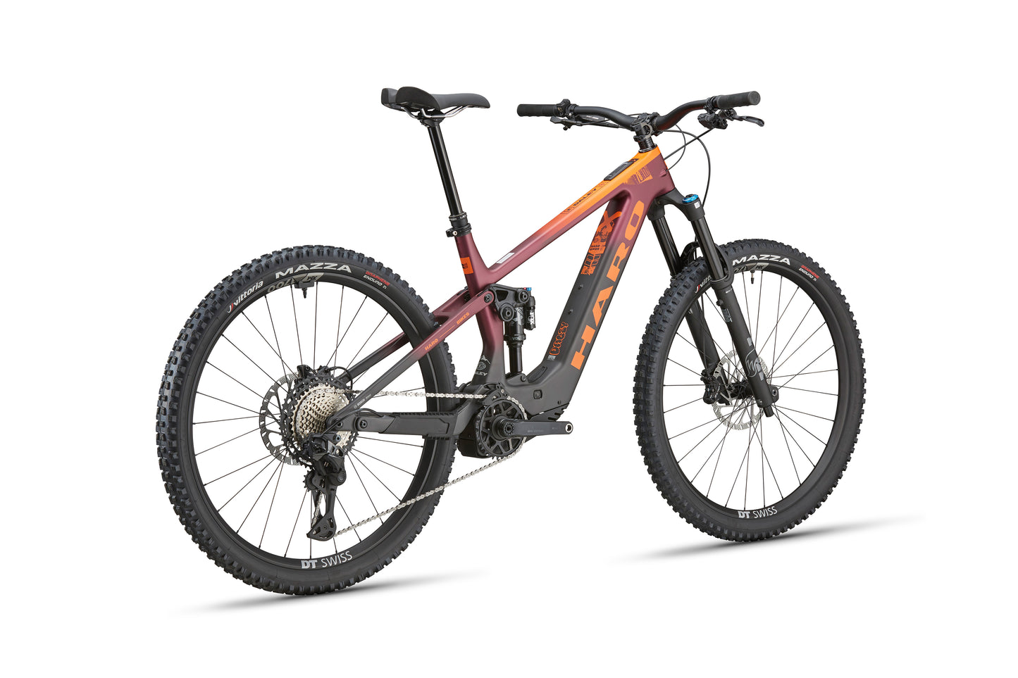 The eDaley Carbon 1 is a maroon-orange lightweight ebike with thick tires, disc brakes, and a sturdy frame, seen from the rear side.