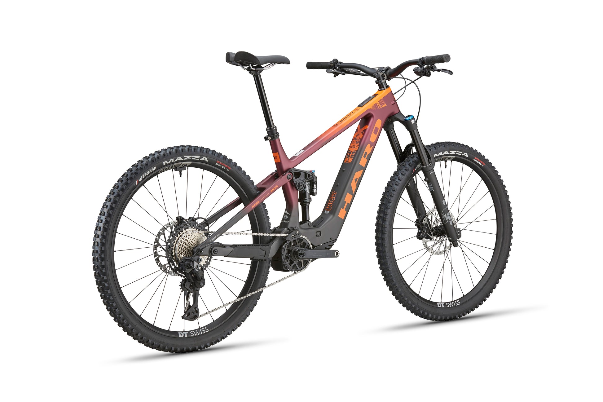 The eDaley Carbon 1 is a maroon-orange lightweight ebike with thick tires, disc brakes, and a sturdy frame, seen from the rear side.