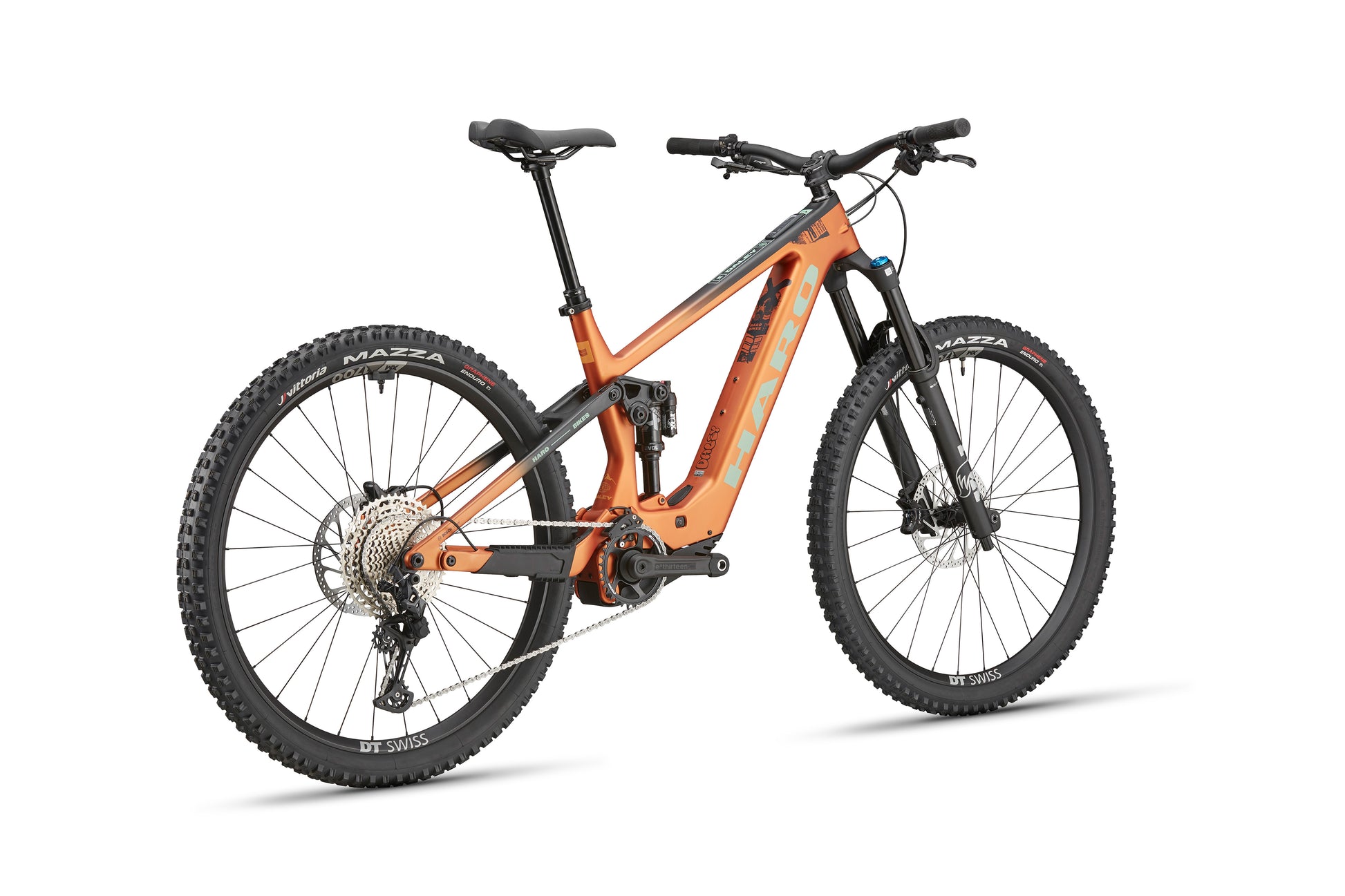 The eDaley Carbon 2 is an orange full-suspension lightweight ebike with Shimano SLX and black tires, shown rear left on white.