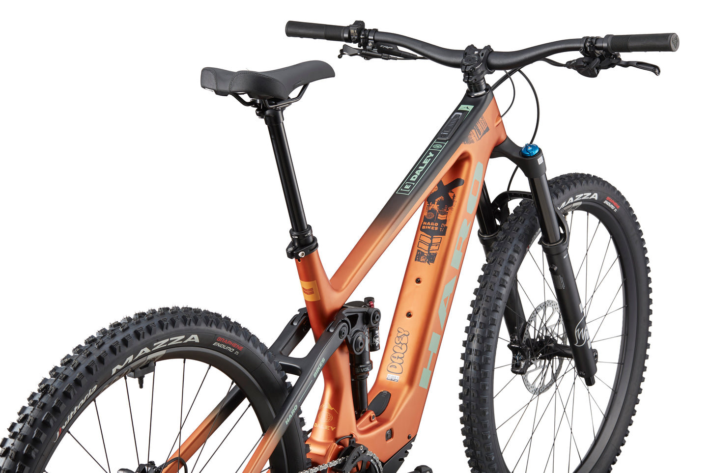 The eDaley Carbon 2, an orange full-suspension mountain bike with thick tires and a Bosch Performance Line SX motor, viewed rear three-quarter.