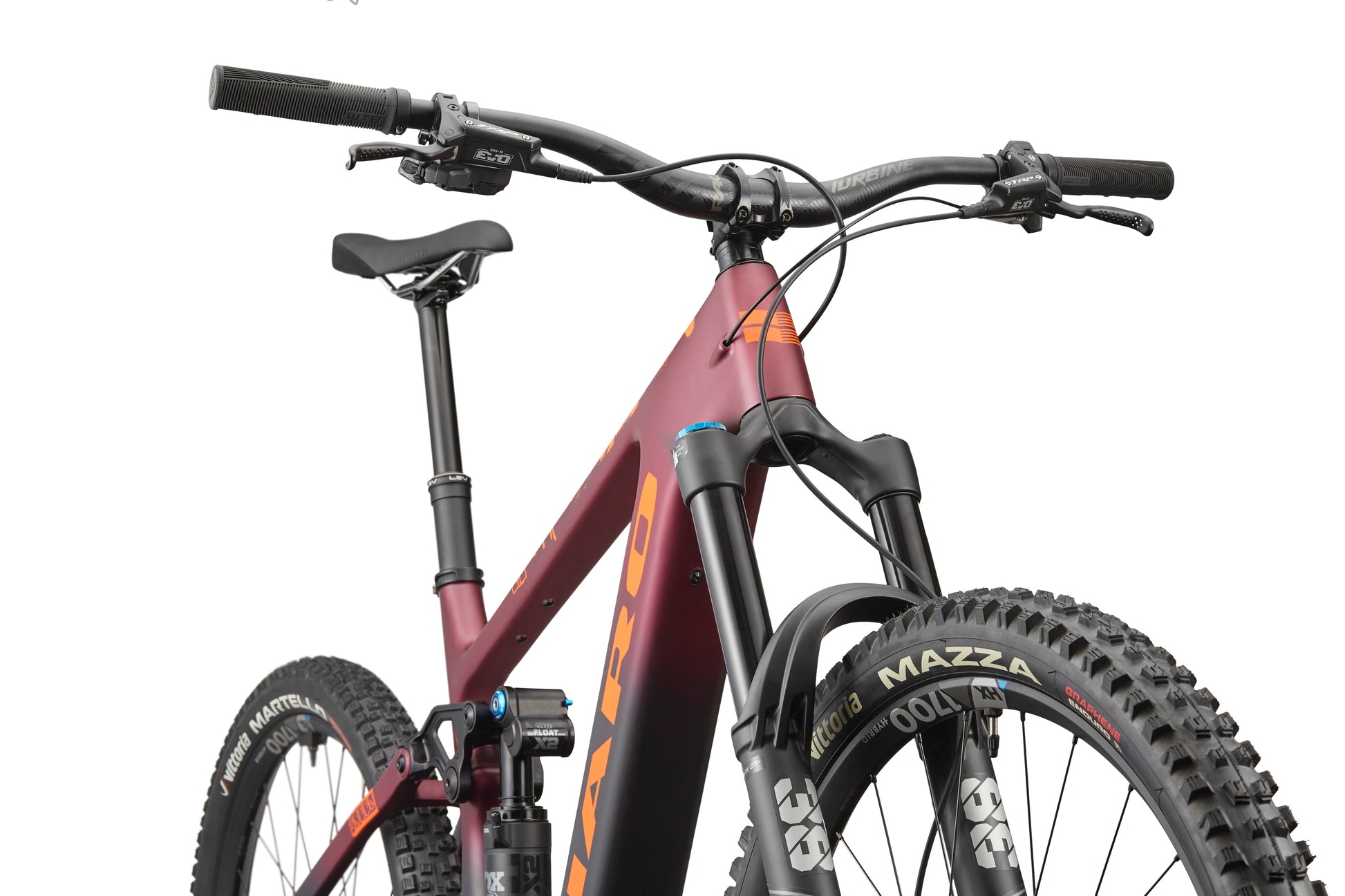 A close-up of the eGreer Carbon 1 mountain bike highlights its red frame, FOX Factory suspension, handlebars, and rugged treaded tires.