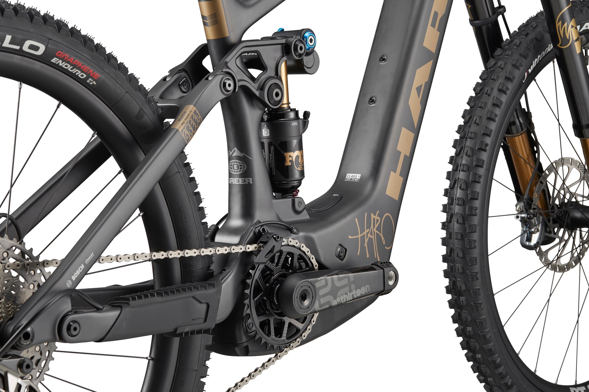 Close-up of eGreer Carbon Top Shelf’s carbon frame, Bosch Performance Line CX drivetrain, suspension, and detailed rear tire.