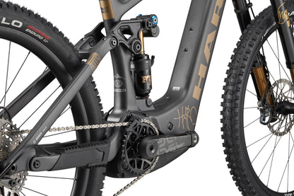 Close-up of eGreer Carbon Top Shelf’s carbon frame, Bosch Performance Line CX drivetrain, suspension, and detailed rear tire.