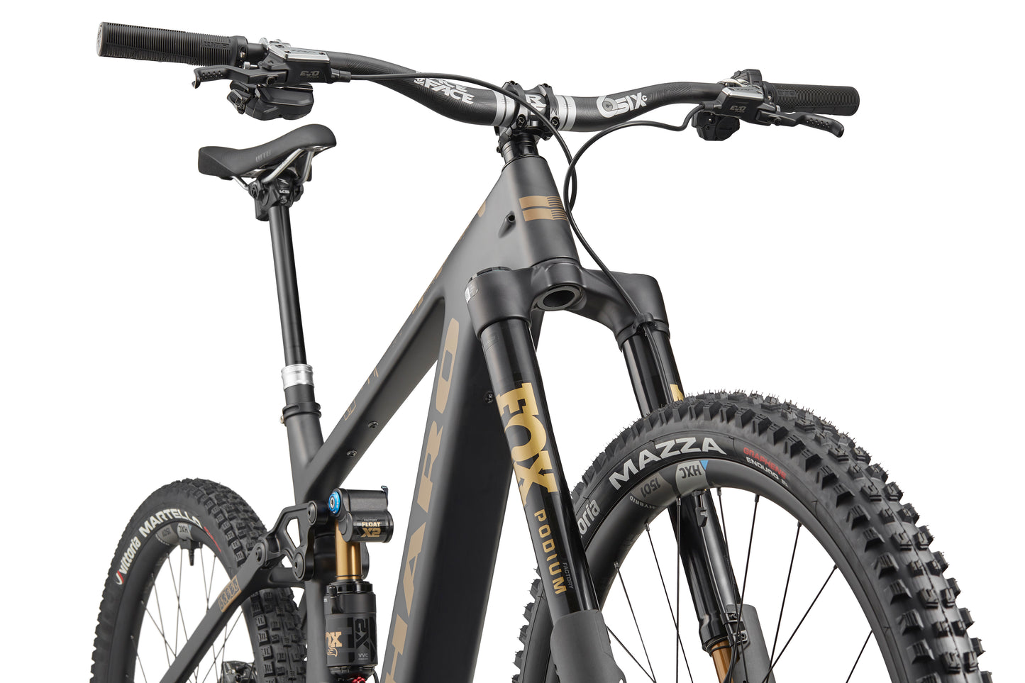 Low-angle shot of the eGreer Carbon Top Shelf: a modern ebike with thick tires, front suspension, and matte black-gold accents.