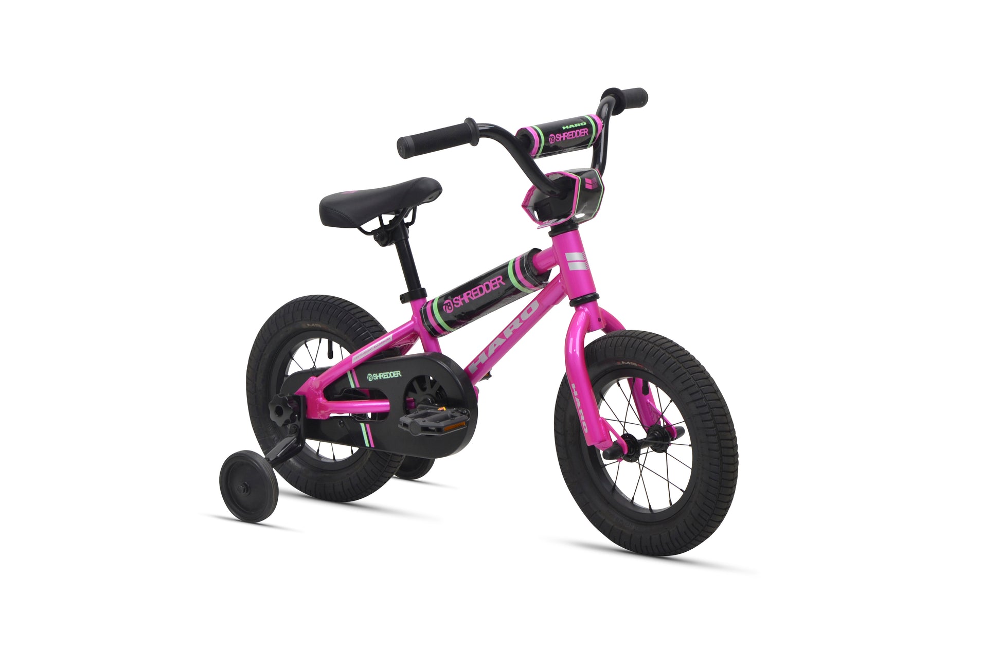 Shredder 12: small pink kids pedal bike with training wheels, black seat and handlebars on white background.